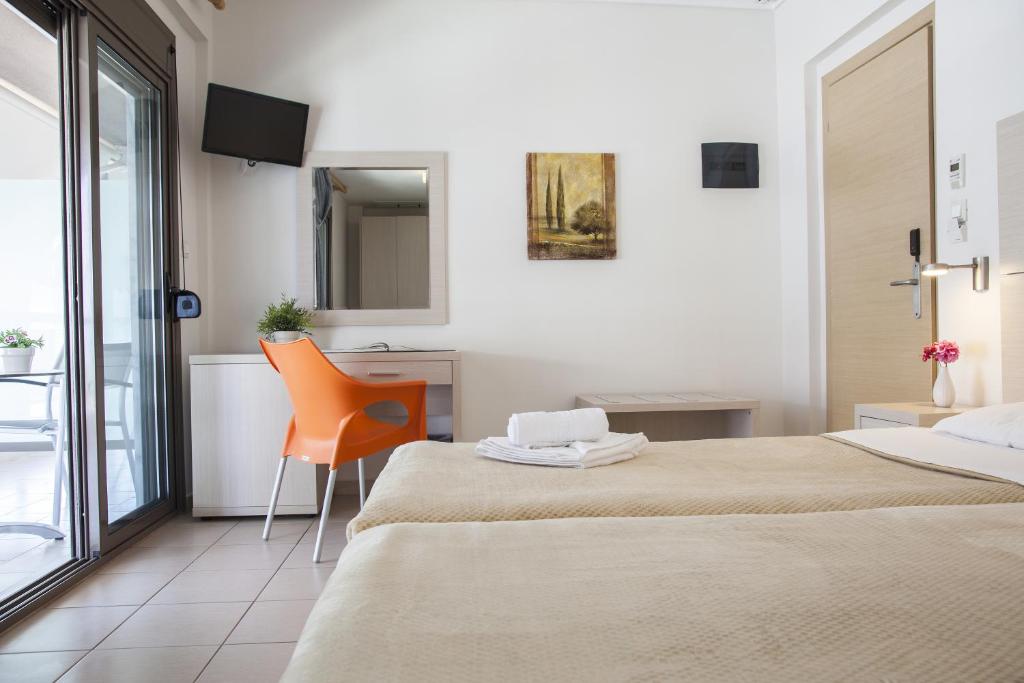 Postel nebo postele na pokoji v ubytování Hotel Mavridis