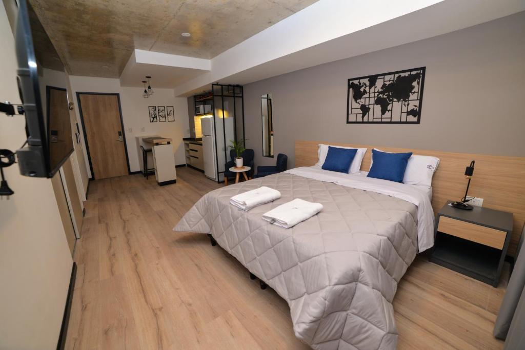 Postel nebo postele na pokoji v ubytování Distrito A FMA-Coliving