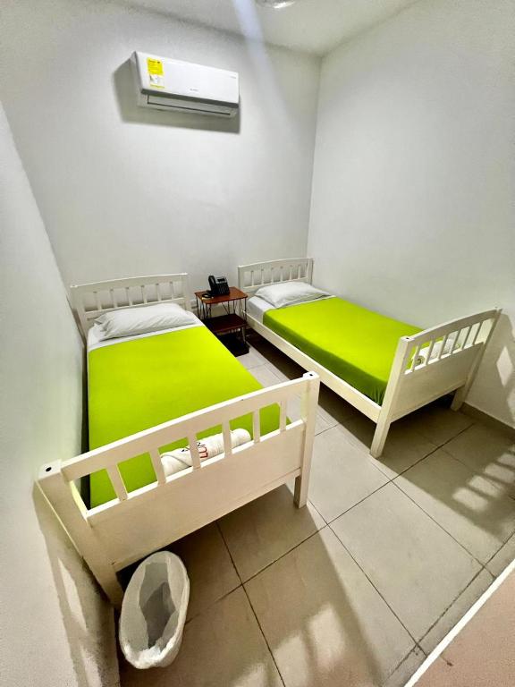 Voodi või voodid majutusasutuse Hostal Lumar toas