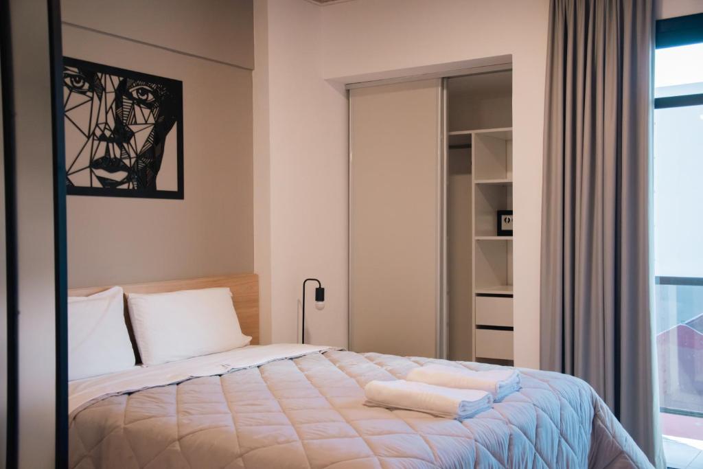 Postel nebo postele na pokoji v ubytování Distrito A FMA-Coliving