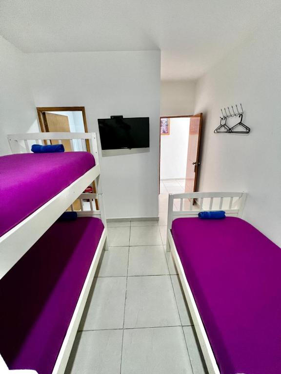 Voodi või voodid majutusasutuse Hostal Lumar toas