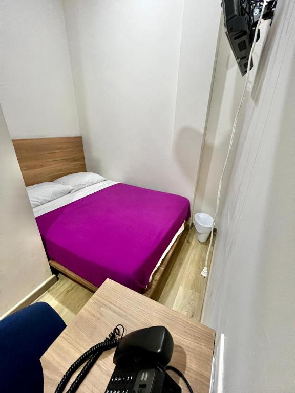 Voodi või voodid majutusasutuse Hostal Lumar toas