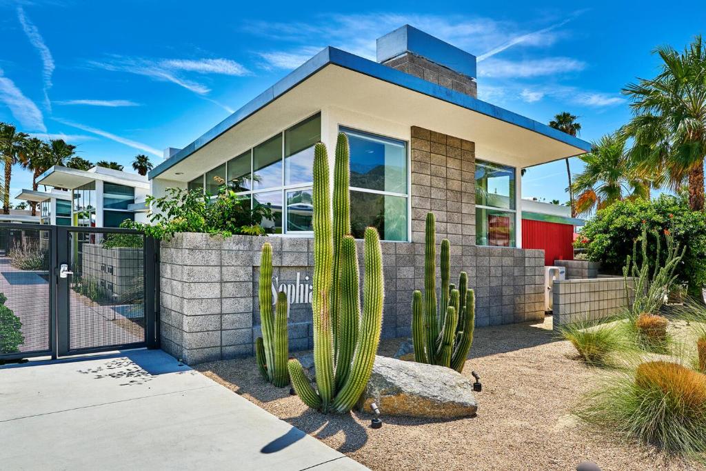 a house with a cactus in front of it at Stunning Palm Springs 2 Bedroom Condo in Palm Springs