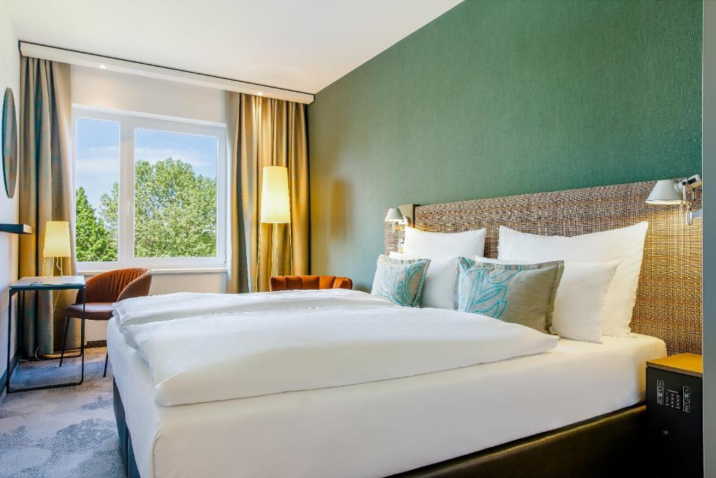 Posteľ alebo postele v izbe v ubytovaní Motel One Wien-Prater