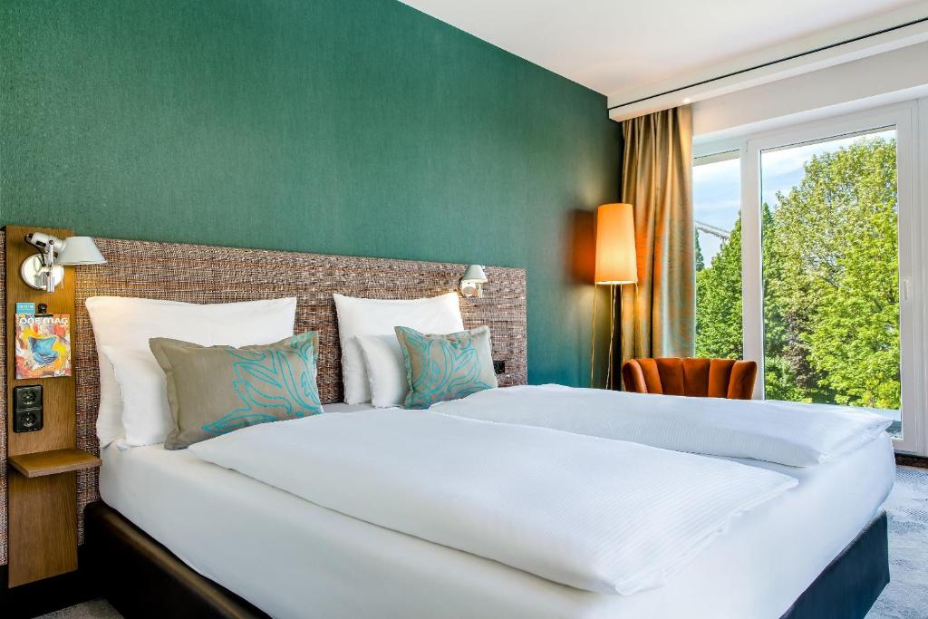 Posteľ alebo postele v izbe v ubytovaní Motel One Wien-Prater