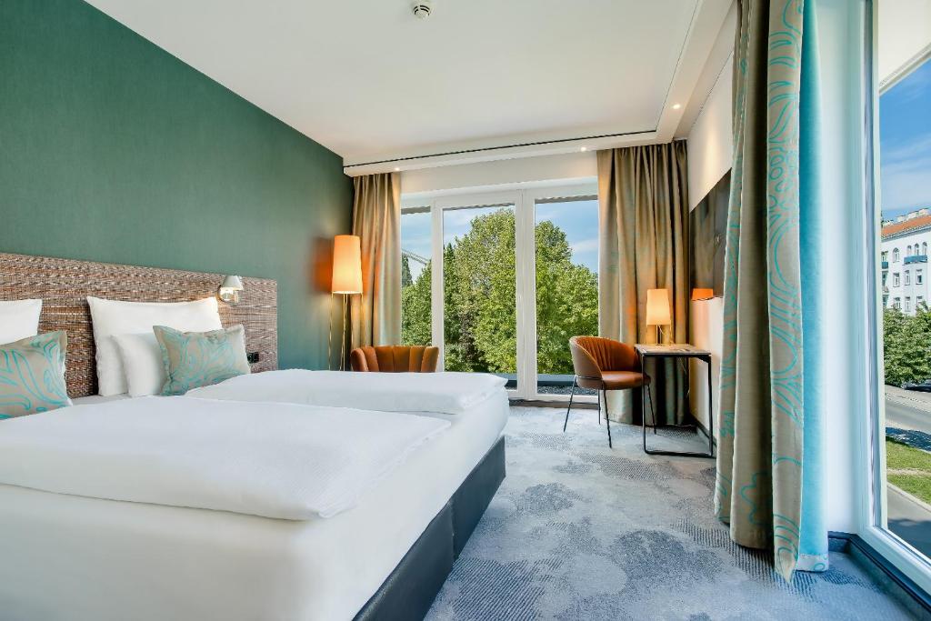 Posteľ alebo postele v izbe v ubytovaní Motel One Wien-Prater