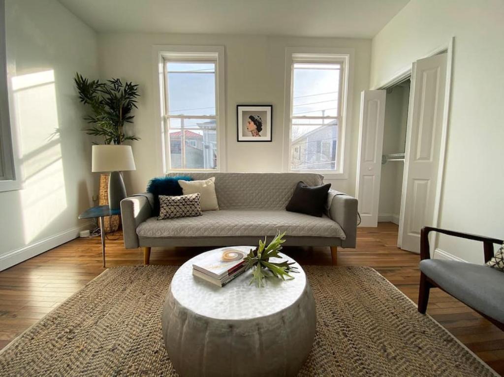 a living room with a couch and a coffee table at Explore Downtown from Adorable Mount Adams in Cincinnati