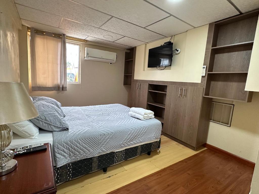 Postel nebo postele na pokoji v ubytování Hostal Posada Del Sol