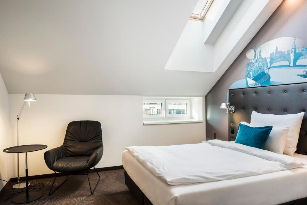 Postel nebo postele na pokoji v ubytování Motel One Basel