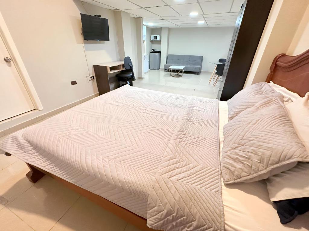 Postel nebo postele na pokoji v ubytování Hostal Posada Del Sol