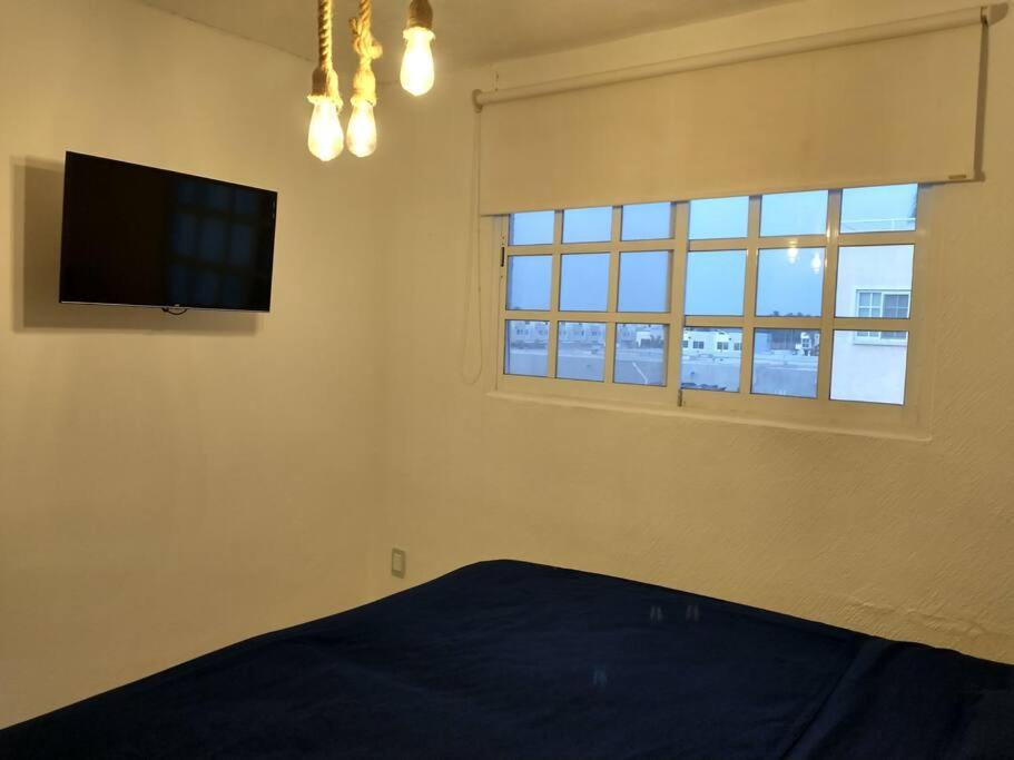 Tempat tidur dalam kamar di Depto con PISCINA PUENTE DEL MAR ACAPULCO