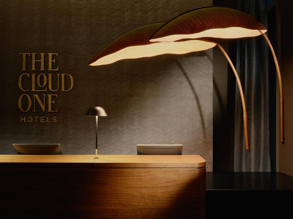 a desk with a lamp on top of it at The Cloud One New York-Downtown, by the Motel One Group in New York