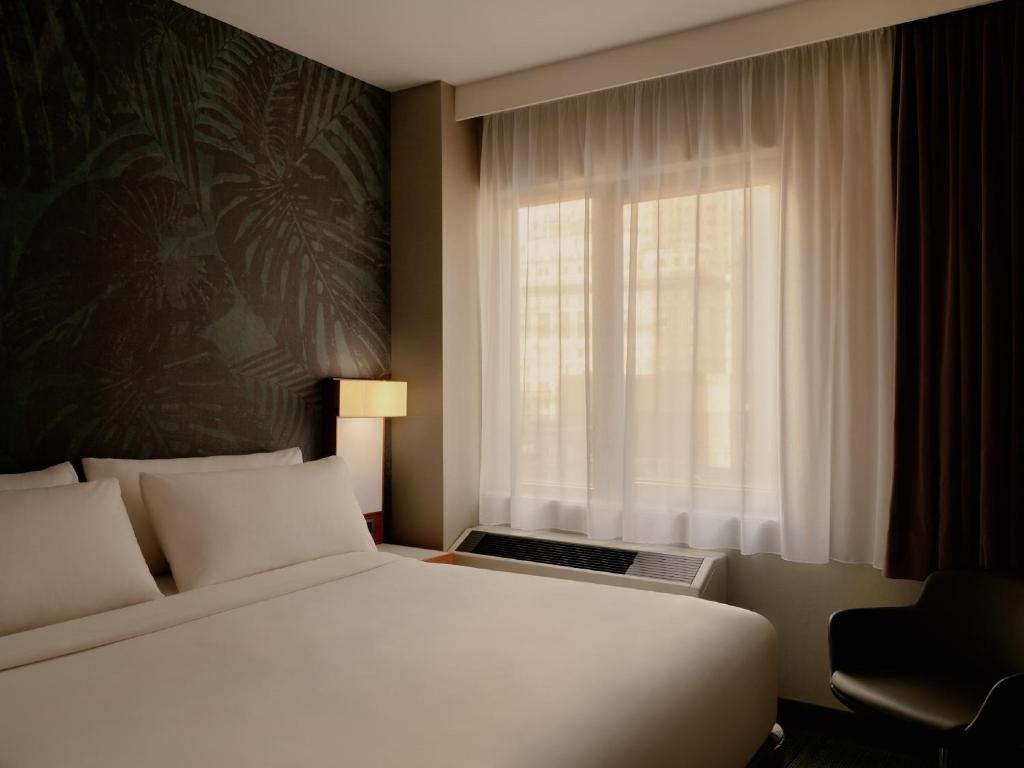 Ein Bett oder Betten in einem Zimmer der Unterkunft The Cloud One New York-Downtown, by the Motel One Group