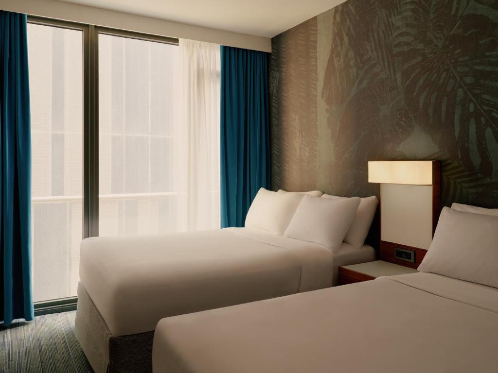Ein Bett oder Betten in einem Zimmer der Unterkunft The Cloud One New York-Downtown, by the Motel One Group