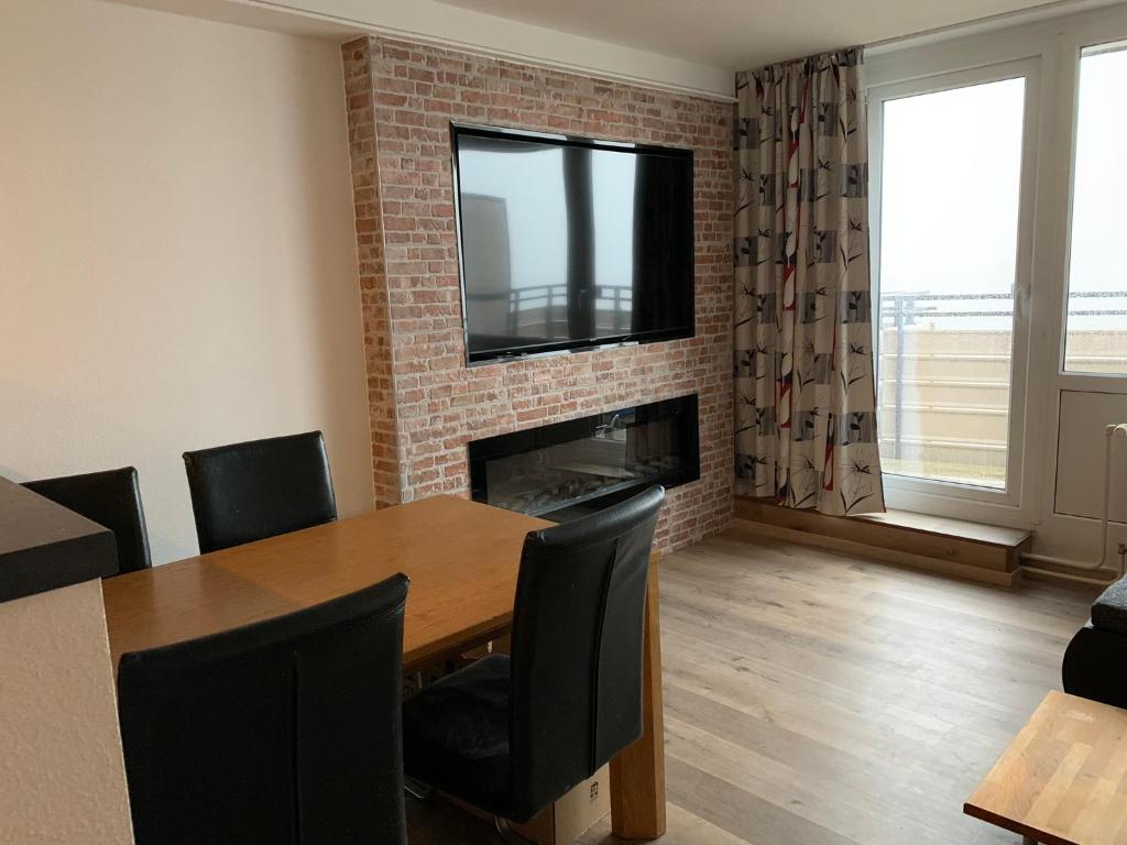 TV a/nebo společenská místnost v ubytování Pleskini Apartment