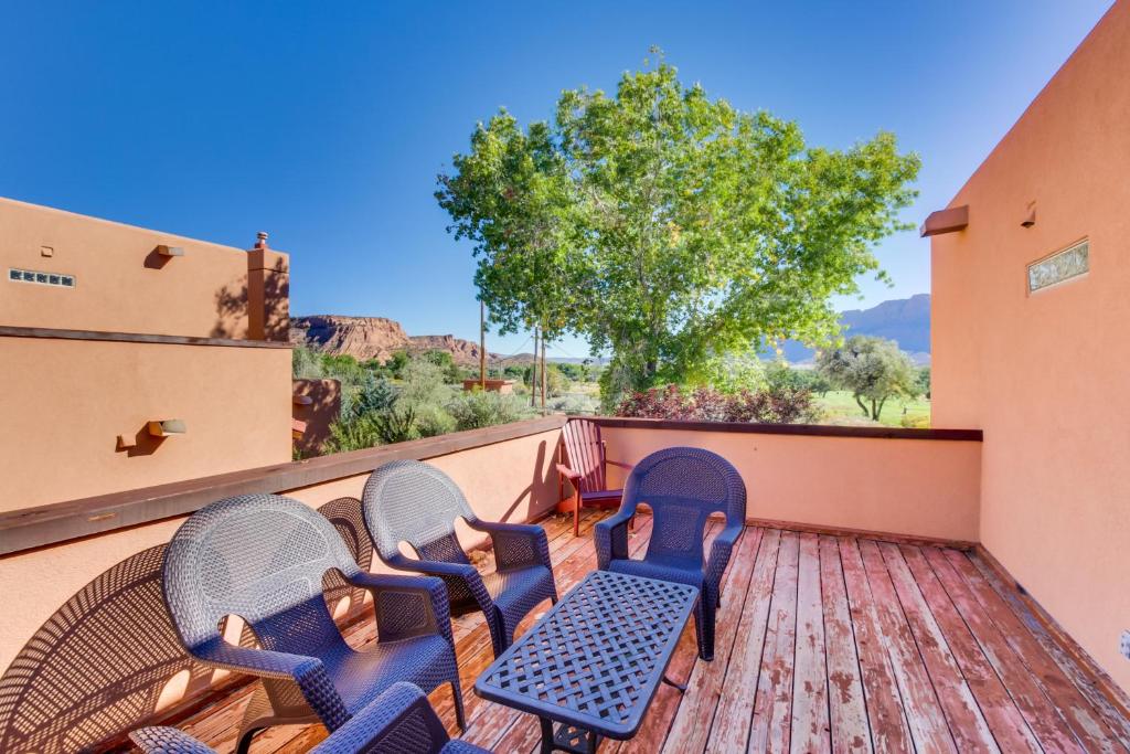 a group of chairs on a deck with a view at Castillo De Las Rocas 3396 in Moab