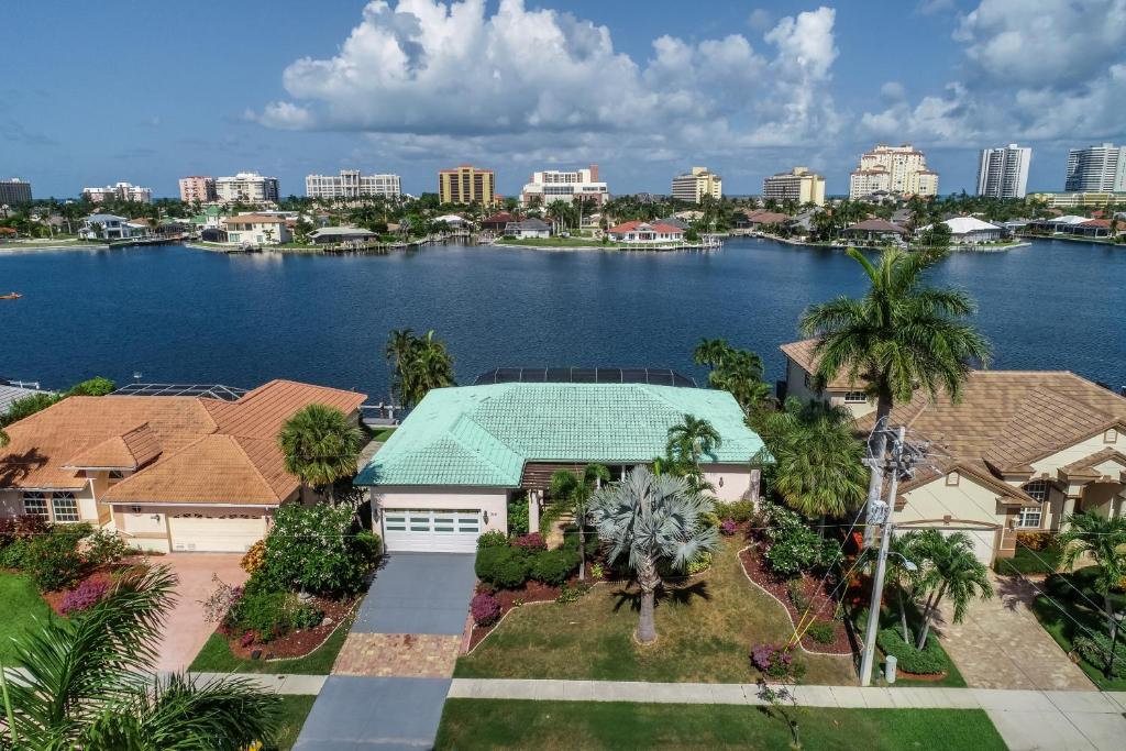 an aerial view of a house with a body of water at The Marco Mariner in Marco Island