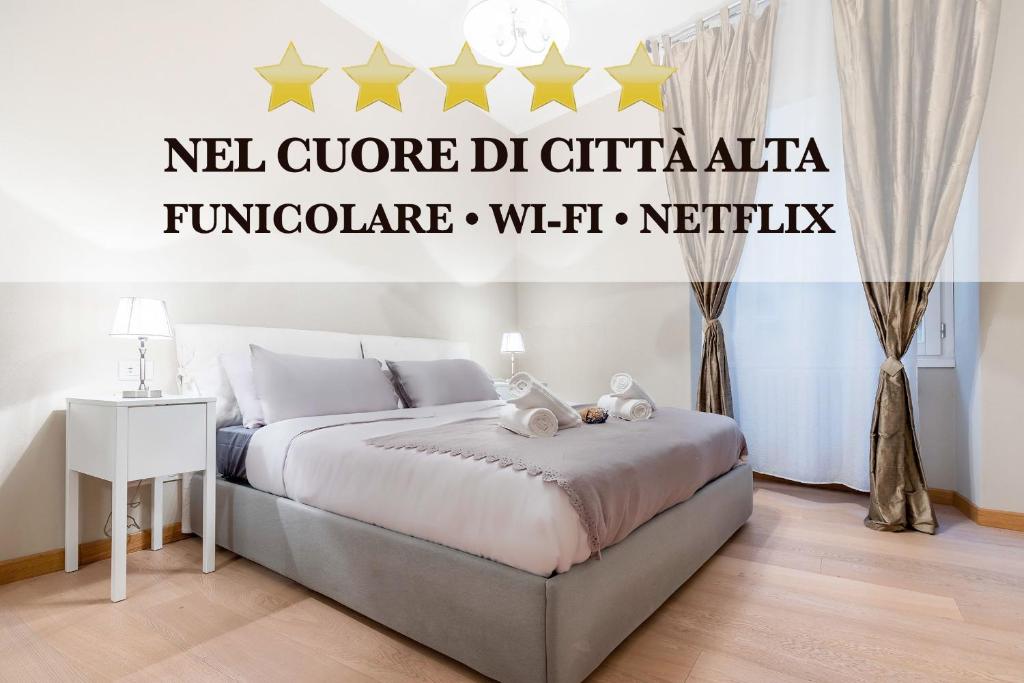 a bedroom with a bed with stars on the wall at FUNICOLARE 23 - Hystoric Apartment Immerso nel Cuore di Città Alta in Bergamo