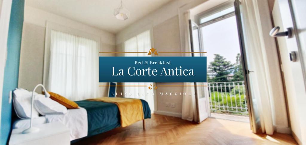 a room with a bed with a sign that reads la centrale antico at B&B La Corte Antica - Luino Lago Maggiore in Luino