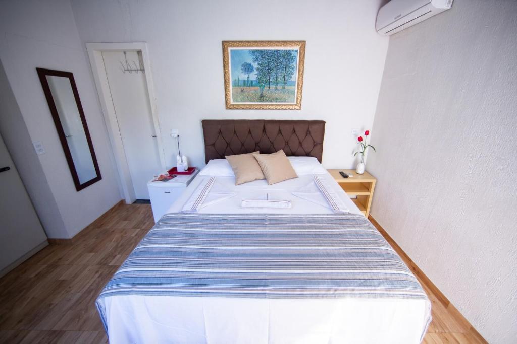 Postel nebo postele na pokoji v ubytování Cachoeira dos pássaros