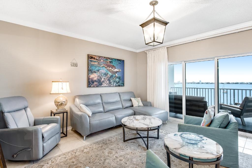 a living room with a couch and chairs at South Harbour 04C in Pensacola Beach