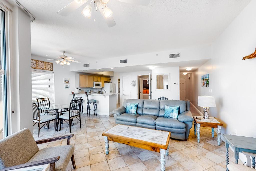 a living room with a couch and a table at Waters Edge 501 in Fort Walton Beach