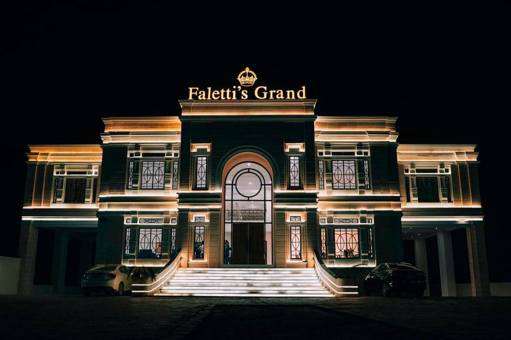 a building with a sign on the front of it at Falettis Grand Bahawalpur in Bahawalpur