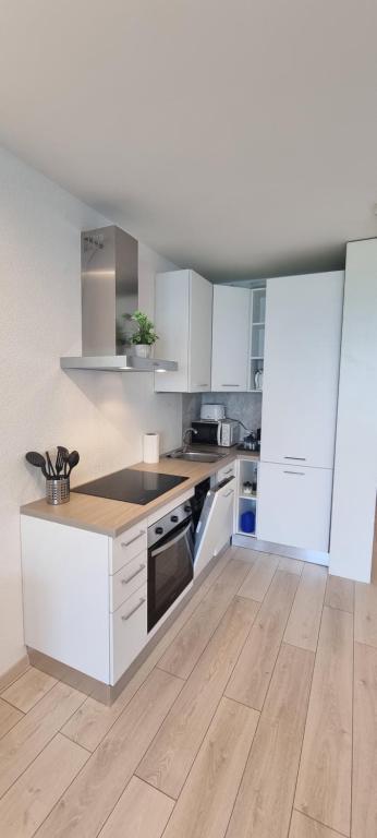 A cozinha ou kitchenette de Bianca Apartment