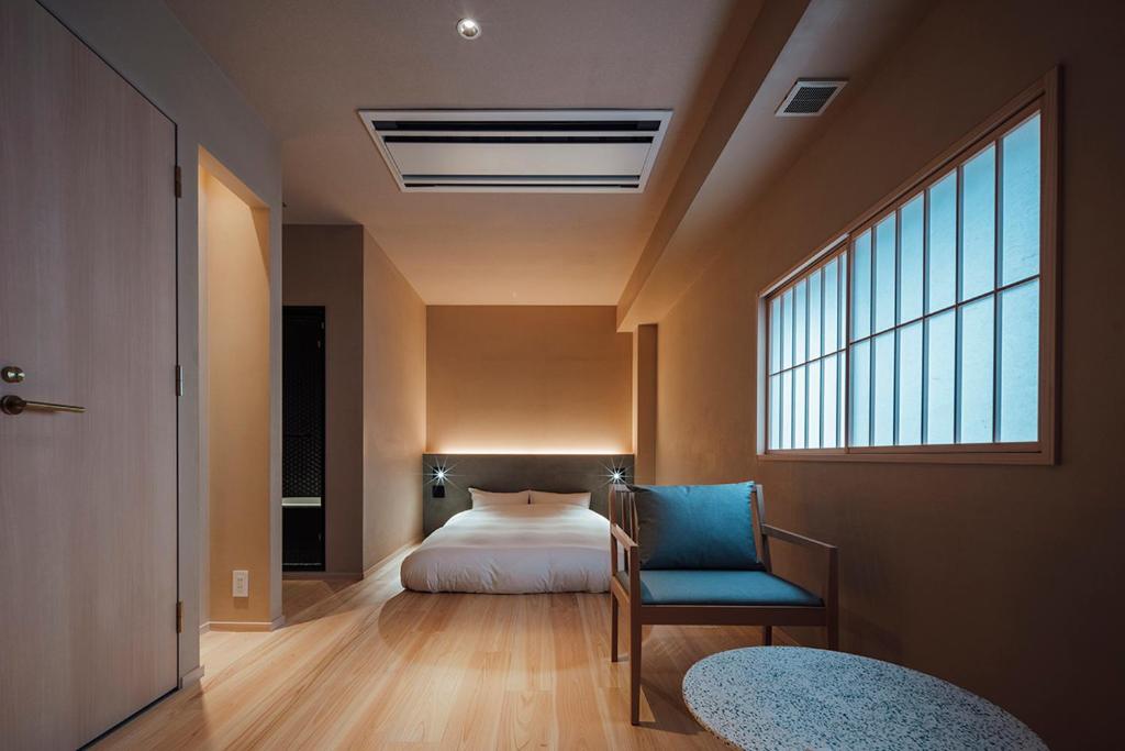 Ένα ή περισσότερα κρεβάτια σε δωμάτιο στο 無垢　入船の宿