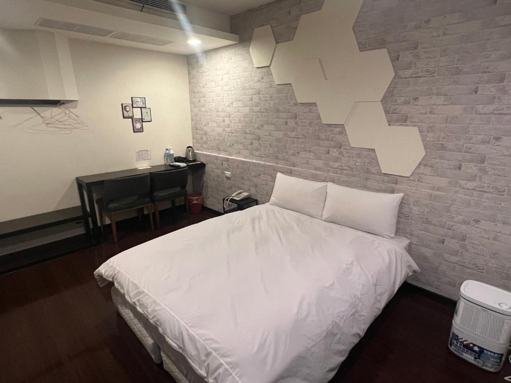 Postel nebo postele na pokoji v ubytování Kaili Hot Spring Hotel