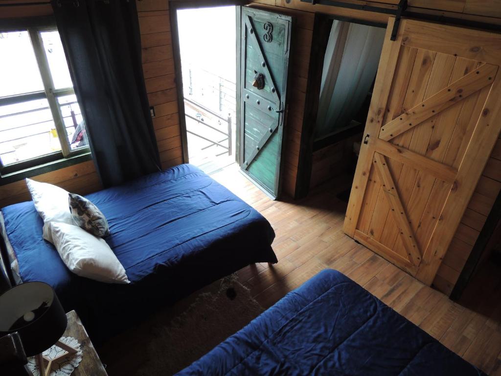 Postel nebo postele na pokoji v ubytování Cabañas Big Mountain