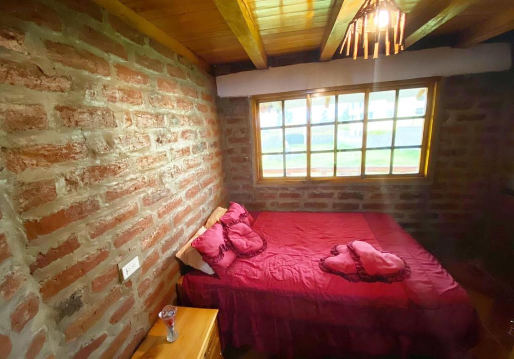 Postel nebo postele na pokoji v ubytování Rumipaxi Lodge
