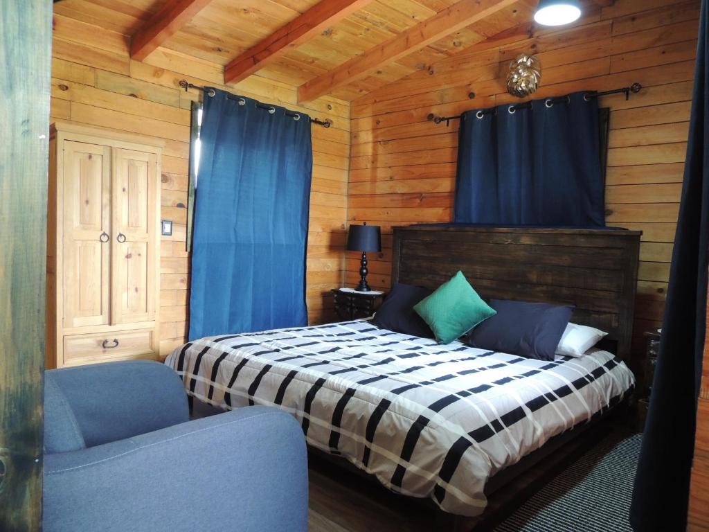 Postel nebo postele na pokoji v ubytování Cabañas Big Mountain