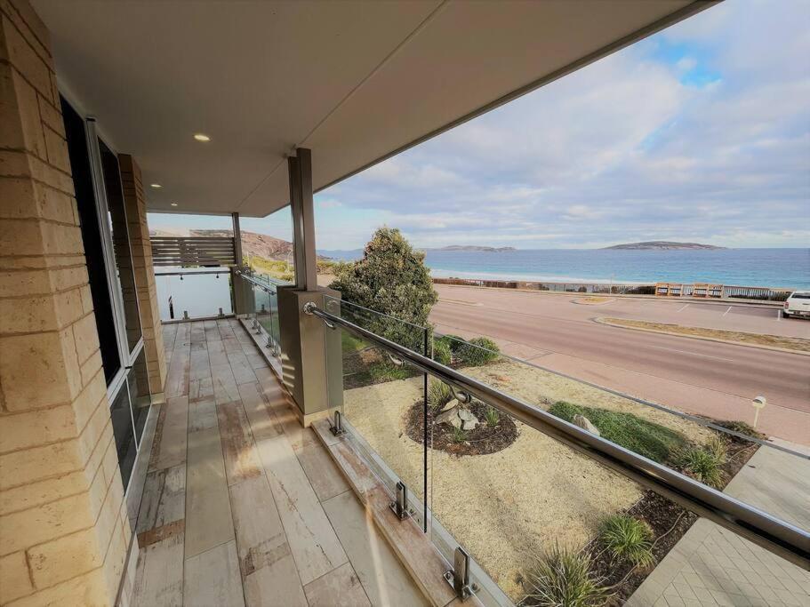 a balcony of a house with a view of the ocean at West Beach House in Esperance