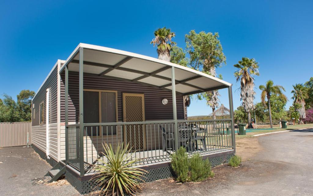a small house with awning on a parking lot at Tasman Holiday Parks - Kalbarri in Kalbarri