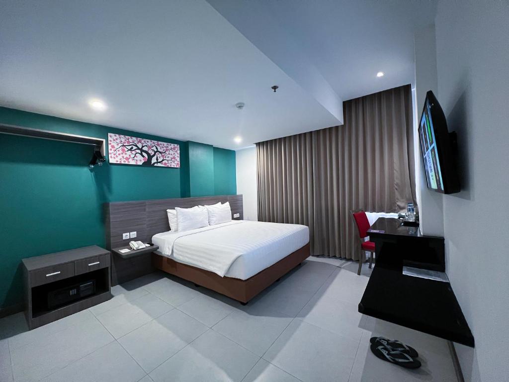 TV a/nebo společenská místnost v ubytování Ayani Hotel Banda Aceh