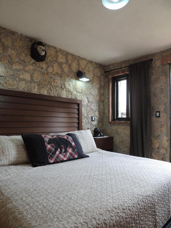 Postel nebo postele na pokoji v ubytování Cabañas Big Mountain
