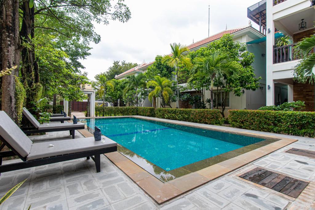 a swimming pool in the backyard of a house at Residence 22 in Siem Reap