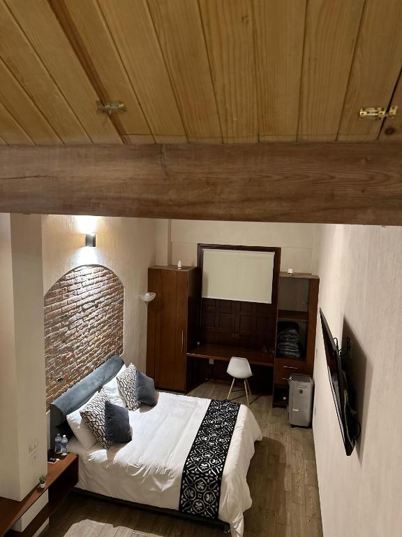 Postel nebo postele na pokoji v ubytování Hotel Del Valle