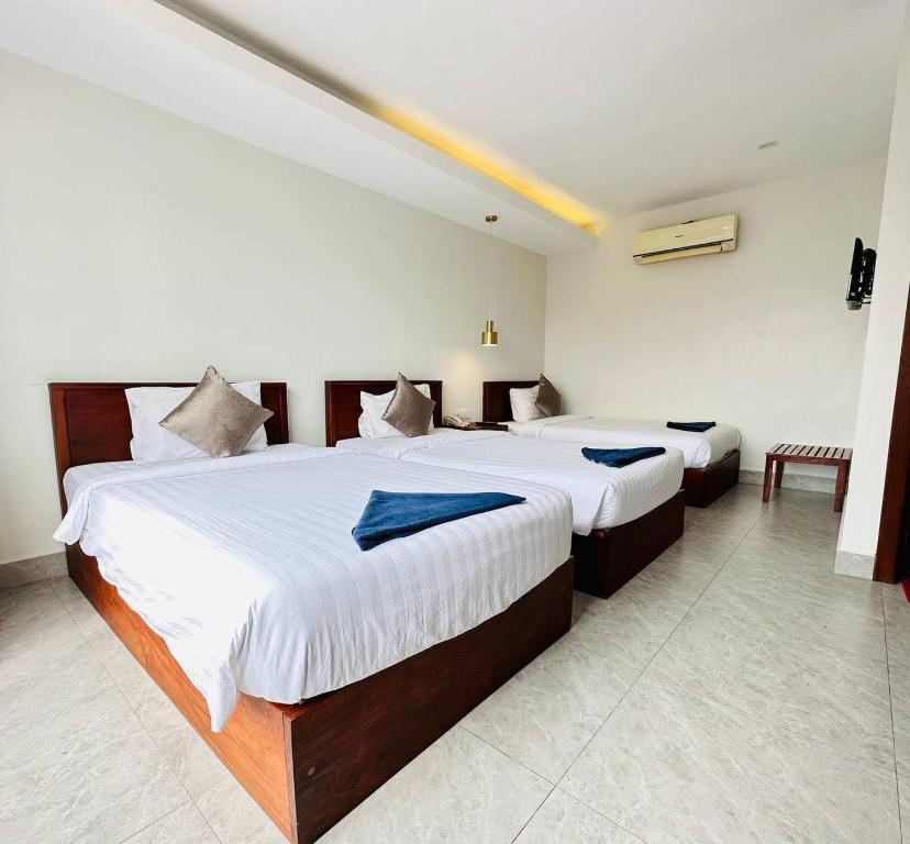 Postel nebo postele na pokoji v ubytování Laluna Guesthouse