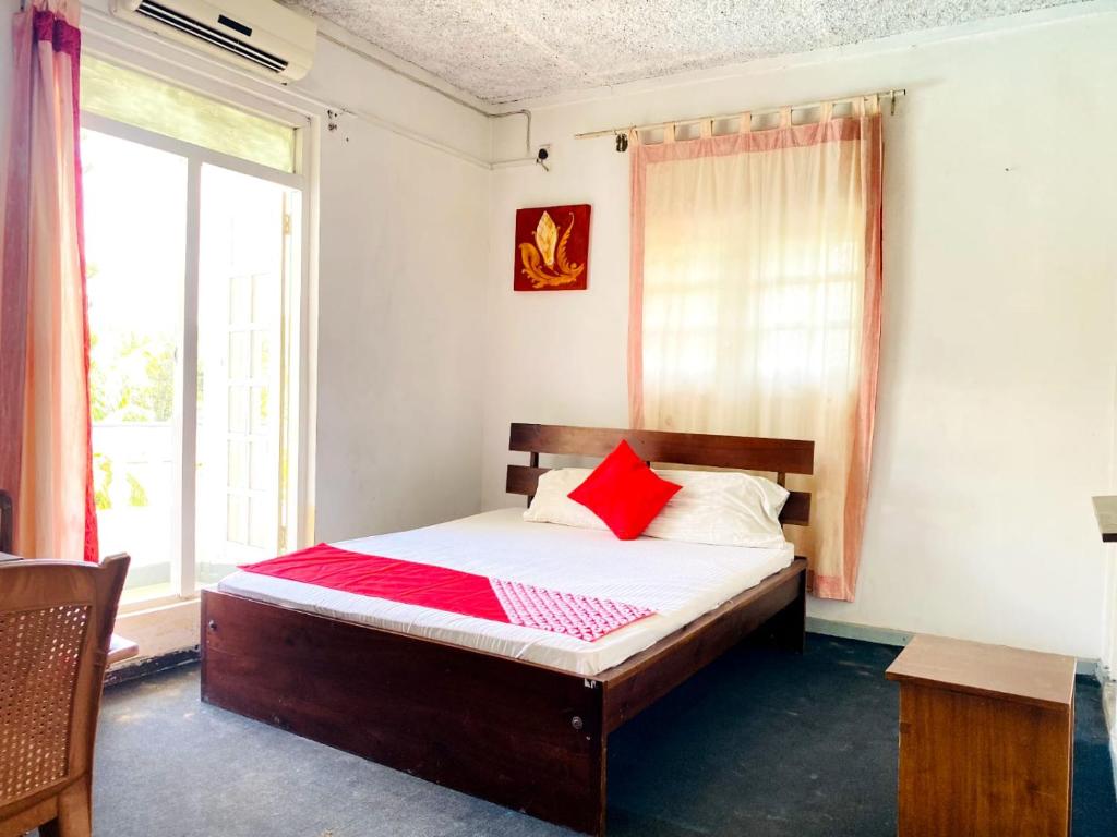 Voodi või voodid majutusasutuse Kandy Lake Layathraa toas