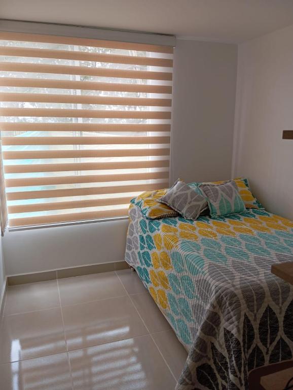 Postel nebo postele na pokoji v ubytování Apartamento en Peña Azul "La Aldea" Ricaurte, Cundinamarca