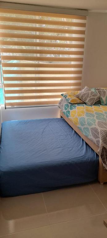 Postel nebo postele na pokoji v ubytování Apartamento en Peña Azul "La Aldea" Ricaurte, Cundinamarca