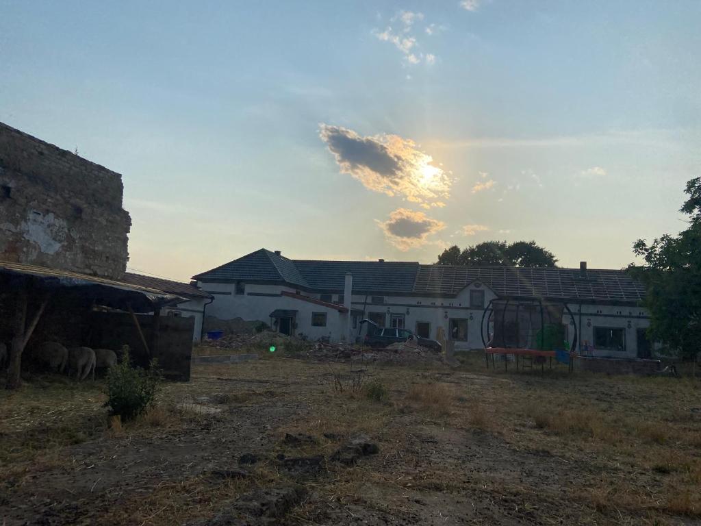 a group of houses with the sun in the sky at SECRET GARDEN LKÁŇ 