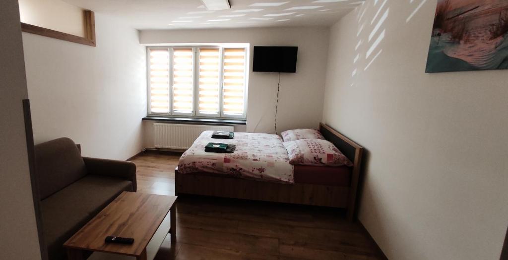 Postel nebo postele na pokoji v ubytování Apartmány Kristýna