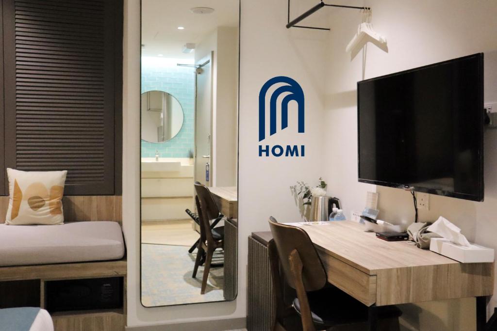 Postel nebo postele na pokoji v ubytování Homi Breeze at Sutera Avenue 和逸微风