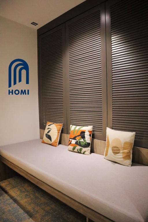Postel nebo postele na pokoji v ubytování Homi Breeze at Sutera Avenue 和逸微风