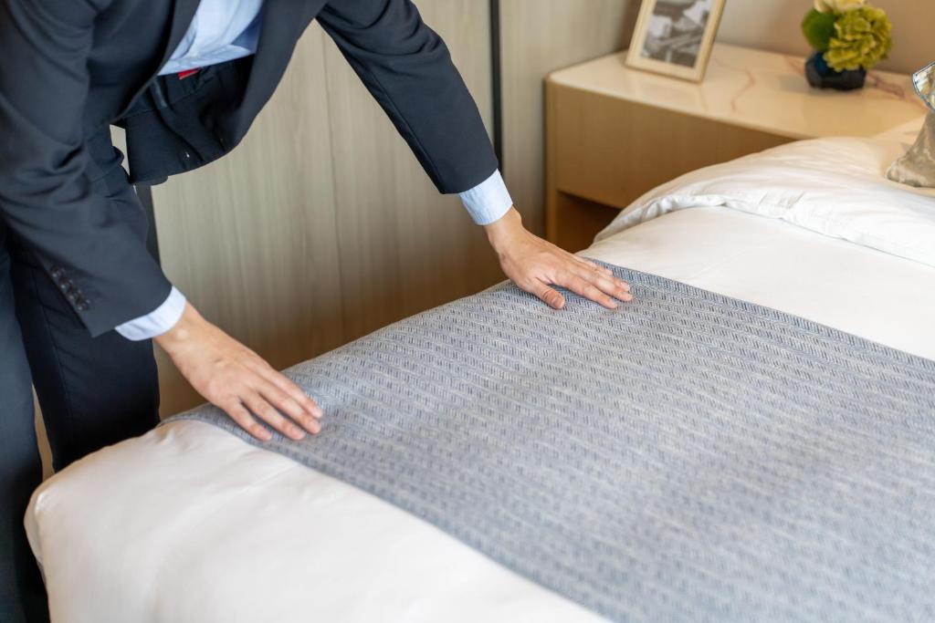 Postel nebo postele na pokoji v ubytování Keypai Hotel