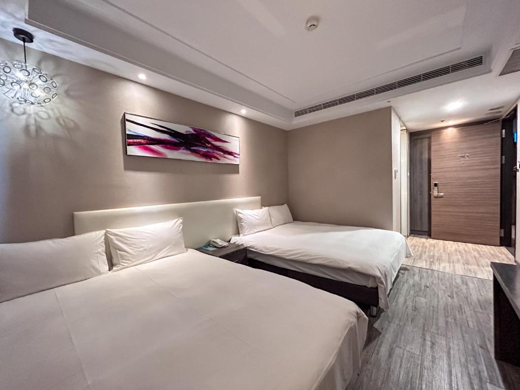 Postel nebo postele na pokoji v ubytování Royal Fine Hotel