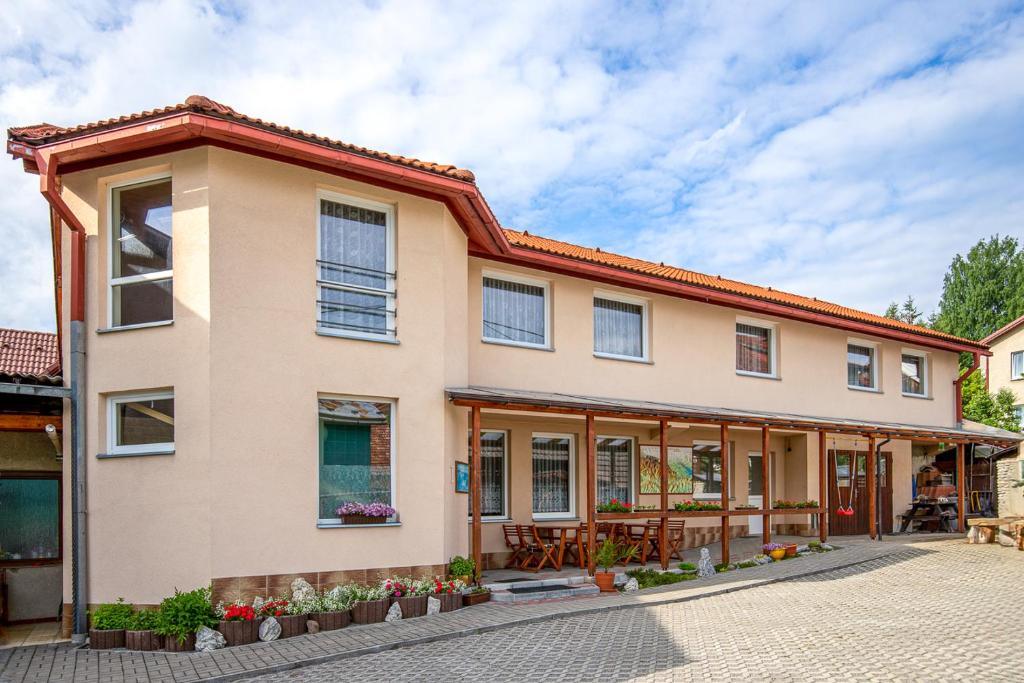 a house with a lot of windows at Penzión Brest Habovka in Habovka